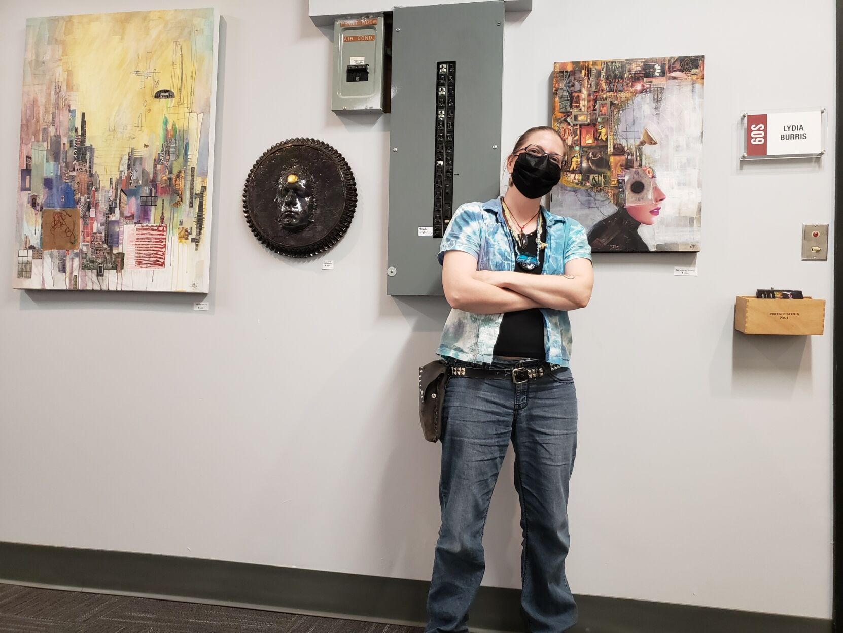 Lydia Burris with two examples of her recent collage work